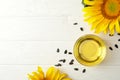Sunflower, seeds and oil on white wooden Royalty Free Stock Photo