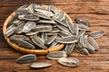 Sunflower seeds pile in bamboo basket Royalty Free Stock Photo