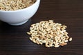 A plate with sunflower seeds peeled on a table Royalty Free Stock Photo