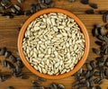 Sunflower seeds in the small bowl on the wooden background Royalty Free Stock Photo