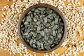 Sunflower seeds in the small bowl on the wooden background Royalty Free Stock Photo