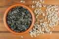 Sunflower seeds in the small bowl on the wooden background Royalty Free Stock Photo