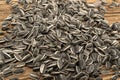 Sunflower Seeds, Striped Raw Seeds on Wood Background Texture Closeup Royalty Free Stock Photo