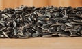 Sunflower seeds on wooden surface Royalty Free Stock Photo