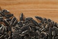 Sunflower seeds on wooden surface Royalty Free Stock Photo