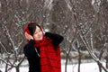Girls in red and black scarves in the snow Royalty Free Stock Photo