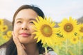 Sunflower and a woman hiding behind it Royalty Free Stock Photo