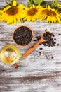 Sunflowers, bottle with oil and sunflower seeds