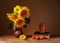 Sunflowers in a ceramic vase and books Royalty Free Stock Photo