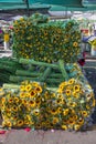 Neatly piled sunflowers with long green stems, Paloquemao Market Royalty Free Stock Photo