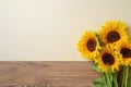 Sunflowers Displayed On Wooden Board, Adding Touch Of Sunshine To The Setting