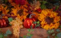 Sunflowers, grapes, and pumpkins fill a decorated Thanksgiving mantel