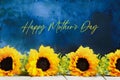 Sunflowers for Mothers Day Against a Blue Painterly Background