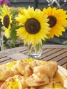 Sunflowers and pastry cheesy snack in the garden