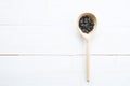 Sunflowers seeds in spoon on white wooden table Royalty Free Stock Photo