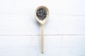 Sunflowers seeds in spoon on white wooden table Royalty Free Stock Photo