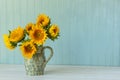 Sunflowers. Summer bouquet in crockery with pastel background Royalty Free Stock Photo
