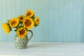 Sunflowers. Summer bouquet in crockery with pastel background Royalty Free Stock Photo