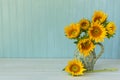 Sunflowers. Summer bouquet in crockery with pastel background Royalty Free Stock Photo