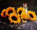 Sunflowers, sunflower seeds and a bottle of oil Royalty Free Stock Photo