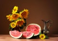 Sunflowers in a vase and fresh watermelon Royalty Free Stock Photo