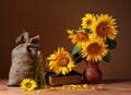 Sunflowers in a vase and a sack of jute Royalty Free Stock Photo