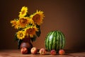Sunflowers in a vase and watermelon Royalty Free Stock Photo