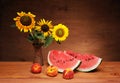 Sunflowers in a vase and watermelon Royalty Free Stock Photo