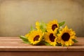 Sunflowers on wooden table