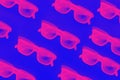 Sunglasses against blue background neon seamless pattern