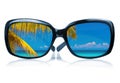 Sunglasses with a beach reflected on the glass Royalty Free Stock Photo