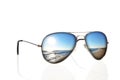 Sunglasses with beach reflection over white Royalty Free Stock Photo