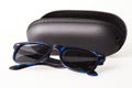 Sunglasses with black open protective case isolated