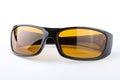 Sunglasses with black plastic frame and yellow glass on a white background Royalty Free Stock Photo