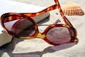 Sunglasses and book on sand Royalty Free Stock Photo