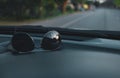 Sunglasses on car panel with while traveling on vacation Royalty Free Stock Photo