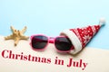 Sunglasses in a Christmas cap Royalty Free Stock Photo