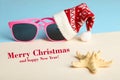 Sunglasses in a Christmas cap Royalty Free Stock Photo