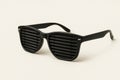 Sunglasses with dark blinds instead of lenses. Space for text. Royalty Free Stock Photo