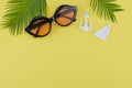 Sunglasses decorate with fern leaves and tiny sailboat and anchor