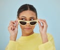 Sunglasses, gen z and young woman in a studio with a casual, stylish and cool sweater outfit. Confident, face and female