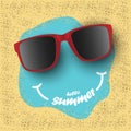 Sunglasses with hello summer text on sea sand, summer concept background