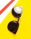 Sunglasses isolated on bright yellow background. Royalty Free Stock Photo