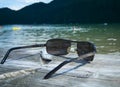 Sunglasses by the lake Royalty Free Stock Photo
