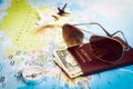 Sunglasses, Passport, Money, Compass and aircraft on the world m Royalty Free Stock Photo