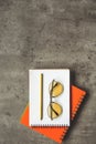 Sunglasses and pencil locating on copybook