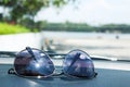 Sunglasses placed on car console