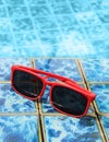 Sunglasses poolside in summer Royalty Free Stock Photo