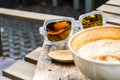 Sunglasses refection of coffee cup