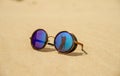 Sunglasses on the hot sand Royalty Free Stock Photo